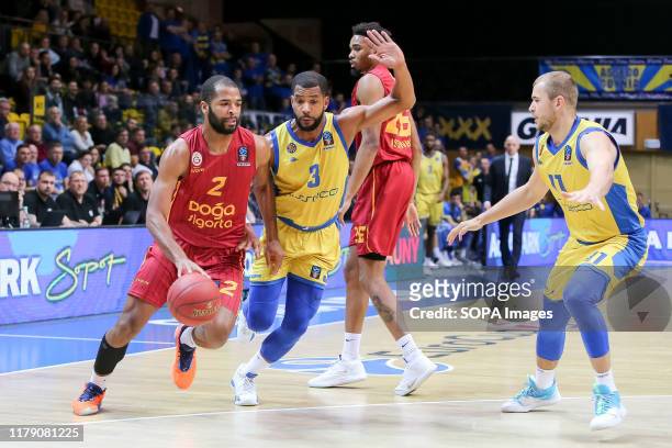 Aaron Harrison , Joshua Bostic and Bartlomiej Woloszyn are seen in action during the 7days EuroCup group D match between Asseco Arka Gdynia and...