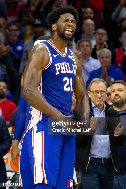 Joel Embiid of the Philadelphia 76ers reacts after getting ejected for fighting Karl-Anthony Towns of the Minnesota Timberwolves in the third quarter...