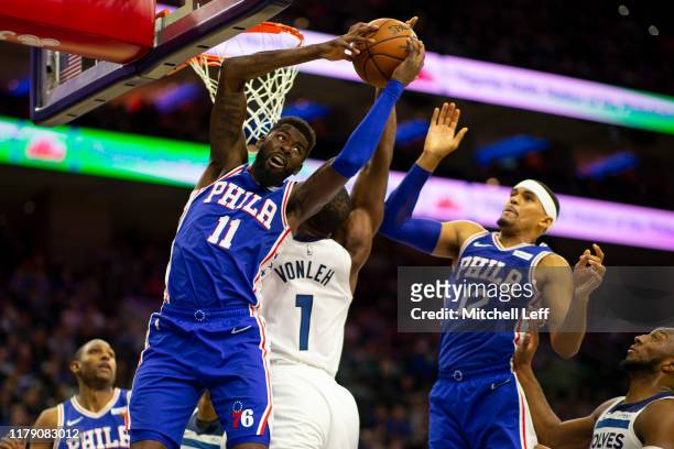 James Ennis III of the Philadelphia 76ers grabs a rebound against Noah Vonleh of the Minnesota Timberwolves in the fourth quarter at the Wells Fargo...