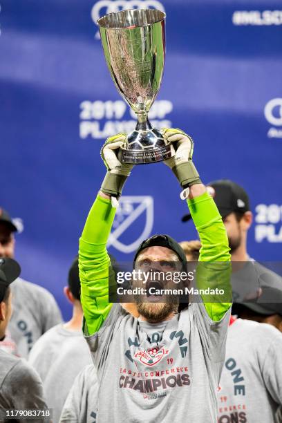 Quentin Westberg of Toronto FC lifts the Eastern Conference trophy following the Eastern Conference Finals between Atlanta United and Toronto FC at...