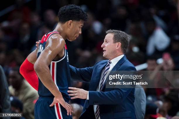 Head coach Scott Brooks of the Washington Wizards speaks with Rui Hachimura during the second half against the Houston Rockets at Capital One Arena...