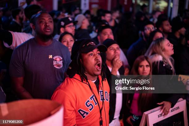 Fans of the Houston Astros react to losing the lead to the Washington Nationals in game 7 of The World Series October 30, 2019 in Houston, Texas....