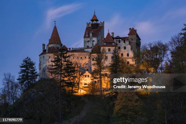 bran castle at sunset - bran castle stock pictures, royalty-free photos & images