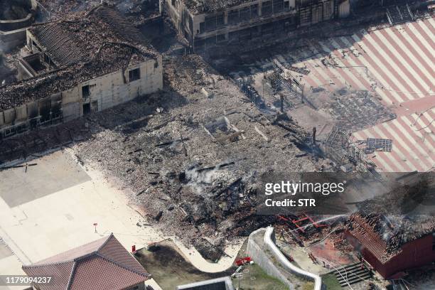 This aerial picture shows the main shrine of Shuri Castle burned down after a fire ripped through the historic site in Naha, Okinawa prefecture,...