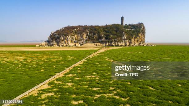 Small island shows up at the bottom of Poyang lake at dry season on 30th October, 2019 in Jiujiang,Jiangxi,China.