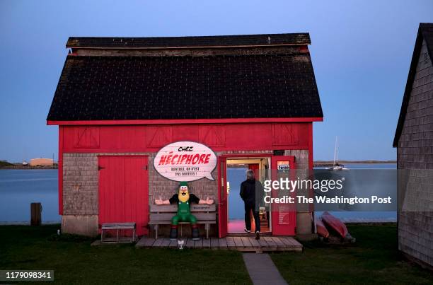 Artist and graphic designer Hugues Poirier enters his shop in La Grave in Magdalen Islands, Quebec on June 18, 2019. Poirier rents the space and is...