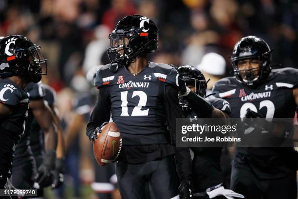 Ahmad Gardner of the Cincinnati Bearcats celebrates after returning an interception 16 yards for a touchdown in the third quarter of the game against...