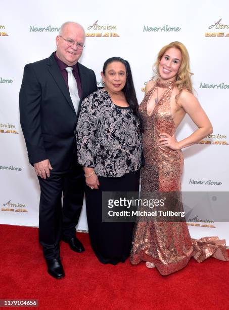 Director Ronnie Michael, executive producer Diana Michael and Actor Ariel Michael attend the premiere of the film "Never Alone" at Arena Cinelounge...