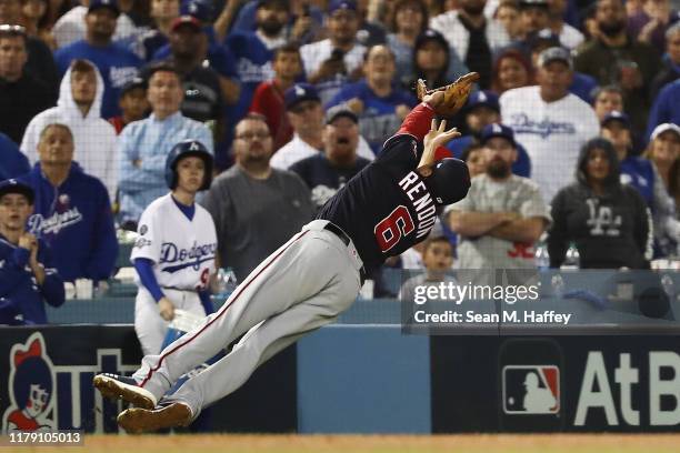 Anthony Rendon of the Washington Nationals catches a fly ball hit by Cody Bellinger of the Los Angeles Dodgers in the ninth inning in game two of the...