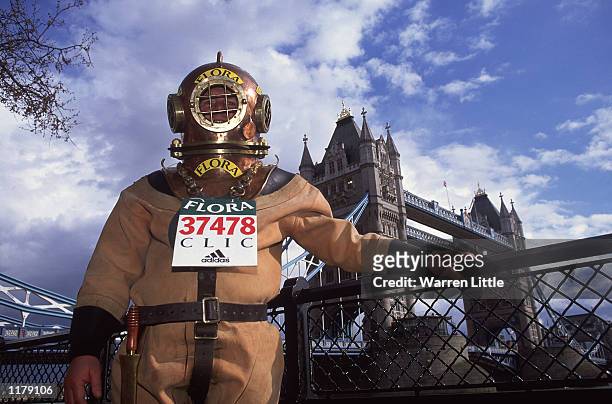 Lloyd Scott of Essex reaches Tower Bridge on April 18 , 2002 as he attempts to complete The 2002 Flora London Marathon dressed in a deep sea diver's...
