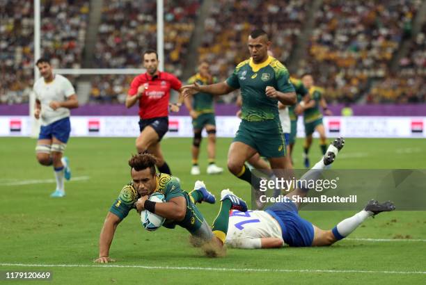 Will Genia of Australia breaks scores his sides fifth try during the Rugby World Cup 2019 Group D game between Australia and Uruguay at Oita Stadium...
