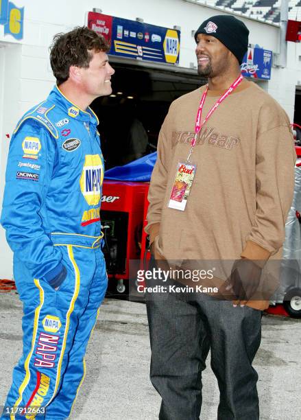 New Jersery Nets forward Rodney Rogers talks with NASCAR Winston Cup driver Michael Waltrip during Daytona 500 practice
