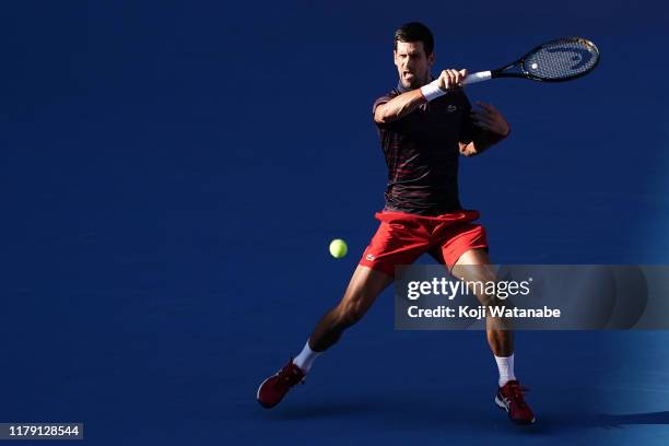 Novak Djokovic of Serbia return shot during his match against David Goffin of Belgium on day six of the Rakuten Open at the Ariake Coliseum on...