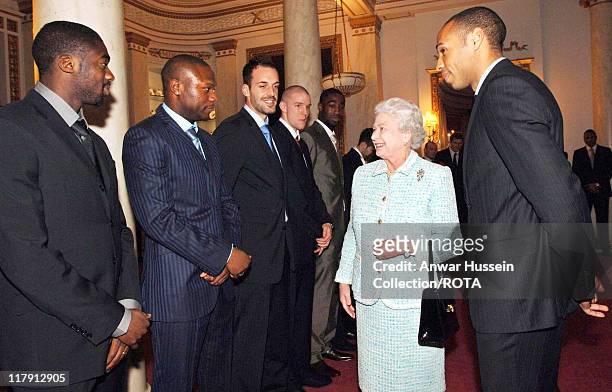 Queen Elizabeth II meets Arsenal football team members ; Kolo Toure, William Gallas, Manuel Almunia, Philippe Senderos and captain Thierry Henry at...