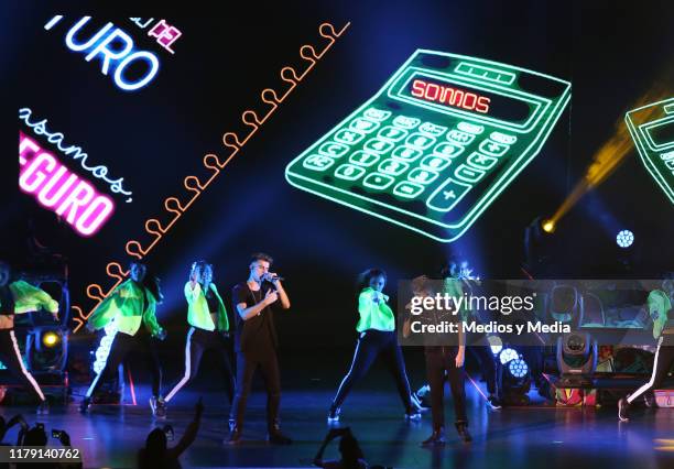 The brothers Adexe & Nau perform during a concert at Auditorio Pabellón on October 4, 2019 in Monterrey, Mexico.