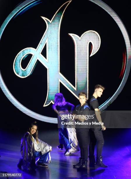 The brothers Adexe & Nau perform during a concert at Auditorio Pabellón on October 4, 2019 in Monterrey, Mexico.