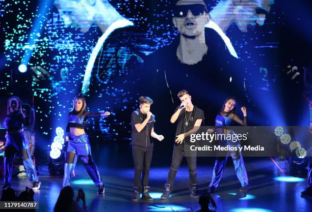 The brothers Adexe & Nau perform during a concert at Auditorio Pabellón on October 4, 2019 in Monterrey, Mexico.