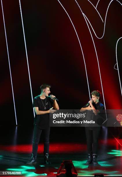 The brothers Adexe & Nau perform during a concert at Auditorio Pabellón on October 4, 2019 in Monterrey, Mexico.