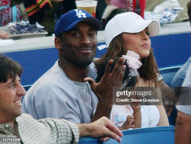 Kobe Bryant sits with his daughter and wife Vanessa during the Los Angeles Dodgers contest against the New York Yankees at Dodger Stadium, June 20,...