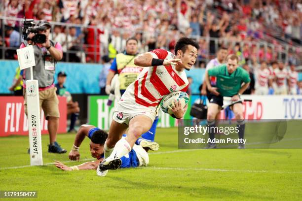 Kenki Fukuoka of Japan scores his teams third try during the Rugby World Cup 2019 Group A game between Japan and Samoa at City of Toyota Stadium on...