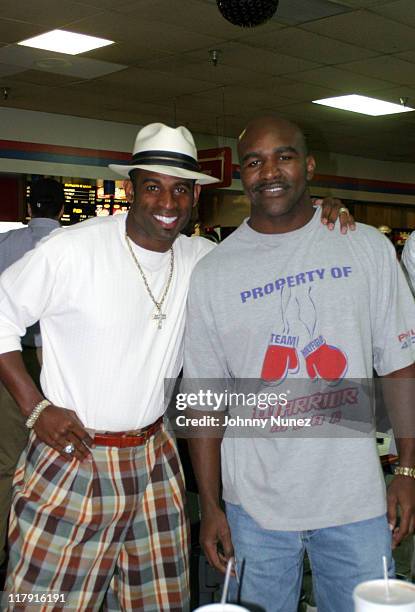 Deion Sanders and Evander Holyfield during Ray Lewis Foundation Celebrity Bowling Match at Normandy Brunswick Lanes in Baltimore, MD.