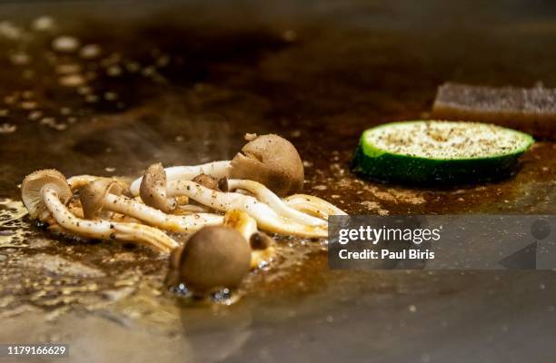 chef cooking grilled vegetables in japanese teppanyaki restaurant, kobe, japan - teppanyaki stock pictures, royalty-free photos & images