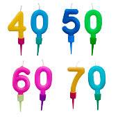 Wax birthday cake candles, numbers, isolated on white background. Forty, fifty, sixty, seventy.