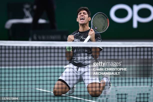 Chile's Christian Garin celebrates after winning against France's Jeremy Chardy during their men's singles tennis match on day four of the ATP World...