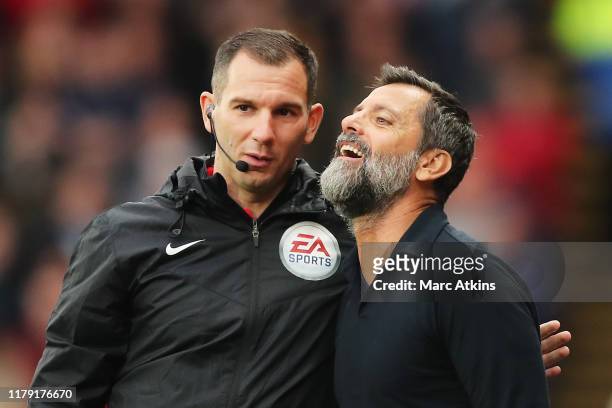 Quique Sanchez Flores, Manager of Watford speaks to fourth official Tim Robinson during the Premier League match between Watford FC and Sheffield...