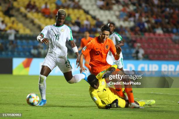 Mikayil Faye of Senegal defends Naoufal Bannis of Netherlands as he collides with Ousmane Ba during the FIFA U-17 World Cup Brazil 2019 group D match...