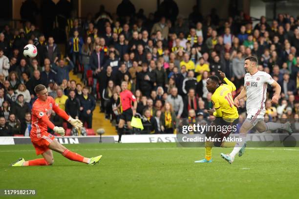 Danny Welbeck of Watford shoots as Dean Henderson of Sheffield United saves during the Premier League match between Watford FC and Sheffield United...