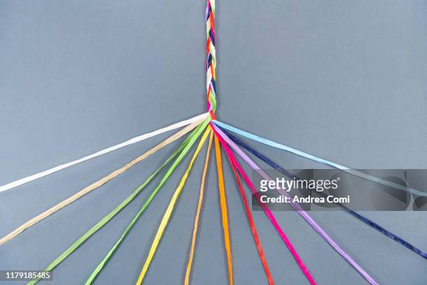 coloured ropes knotting together - harmonie stockfoto's en -beelden