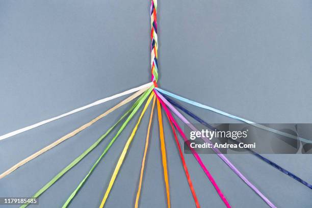 coloured ropes knotting together - strength together stock pictures, royalty-free photos & images