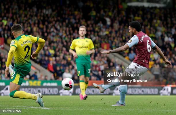 Douglas Luiz of Aston Villa scores his sides 5th during the Premier League match between Norwich City and Aston Villa at Carrow Road on October 05,...