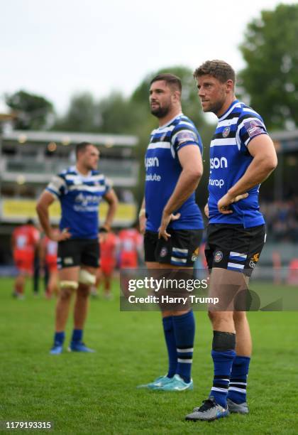 Zach Mercer of Bath Rugby, Elliott Stooke of Bath Rugby and Rhys Priestland of Bath Rugby cut dejected figures at the end of the match during the...