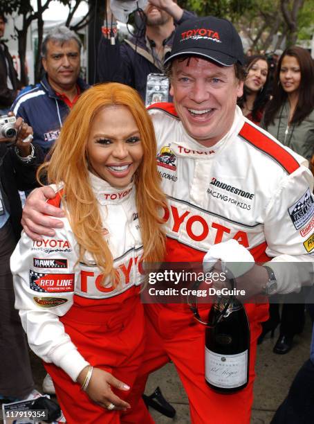 Chris McDonald and Lil' Kim during 28th Annual Toyota Pro/Celebrity Race - Race Day at Streets of Long Beach in Long Beach, California, United States.