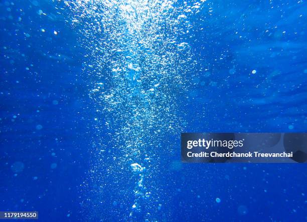 air bubbles in the blue ocean background - standing water stock pictures, royalty-free photos & images