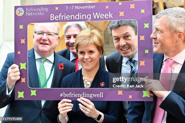 Scotland's First Minister Nicola Sturgeon poses for a charity photocall with party leaders Jackson Carlaw, Richard Leonard, Presiding Officer Ken...