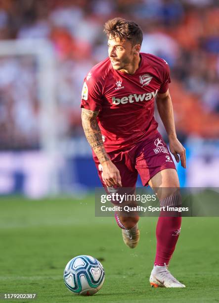 Ximo Navarro of Deportivo Alaves runs with the ball during the Liga match between Valencia CF and Deportivo Alaves at Estadio Mestalla on October 05,...