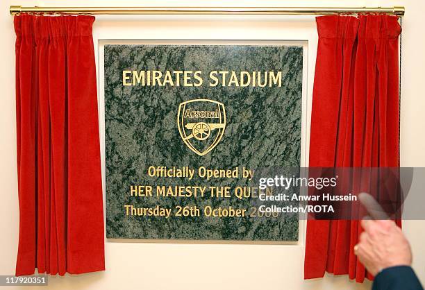 The Duke of Edinburgh unveils a plaque with Arsenal chairman Peter Hill-Wood, as he officially opens the Emirates Stadium in London, 26 October 2006....