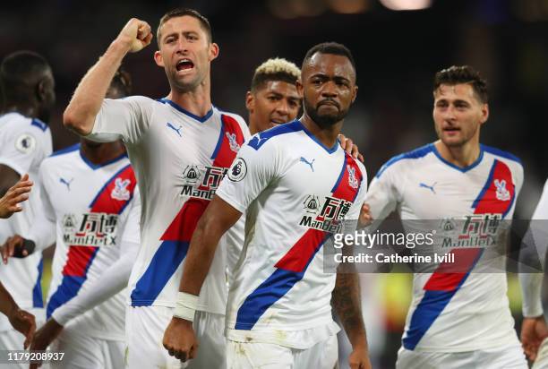 Jordan Ayew of Crystal Palace celebrates with his team mates after scoring his sides second goal which is awarded following a VAR review during the...