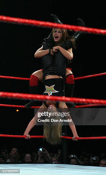 Trish stratus pulls a most unusual move on Mickey James during the WWE RAW Superslam event at the Acer Arena, Homebush Stadium in sydney on august 4,...