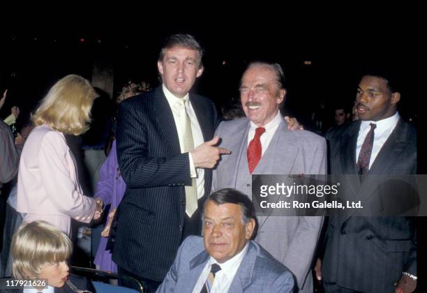 View of, from left, Donald Trump, Jr. , his parents Ivana Trump and Donald Trump, Milos Zelnicek , Fred Trump , and Herschel Walker as they attend a...