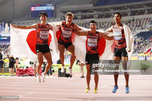 Shuhei Tada, Kirara Shiraishi, Yoshihide Kiryu and Abdul Hakim Sani Brown of Japan celebrate bronze in the Men's 4x100 Metres Relay during day nine...