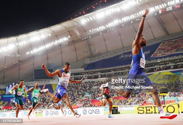 Noah Lyles of the United States, gold, and Nethaneel Mitchell-Blake of Great Britain, silver, compete in the Men's 4x100 Metres Relay during day nine...