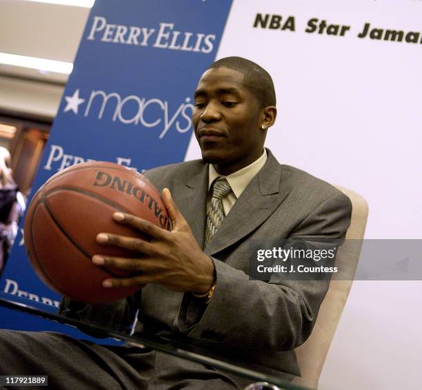 Jamal Crawford signs autographs for fans during Perry Ellis and Travel & Leisure Magazine Host In-Store Appearance by NBA Star Jamal Crawford at...