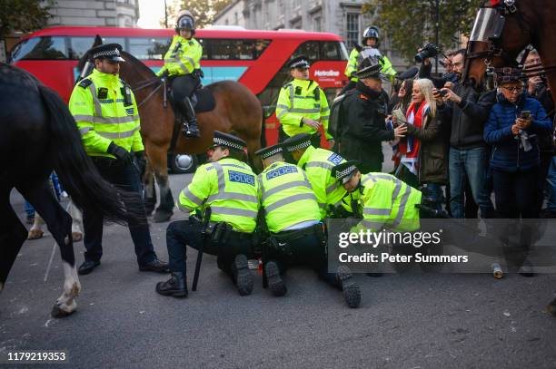 Pro-Brexit activist is arrested on Whitehall on what would have been the day that the United Kingdom left the European Union, on October 31, 2019 in...