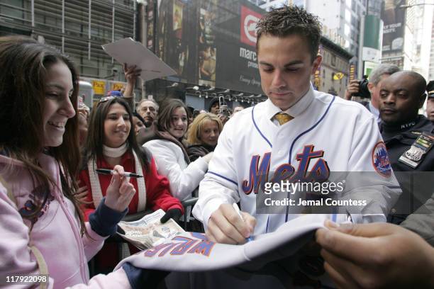 David Wright signs for autographs for fans during David Wright Attends the Unveiling of his Wax Figure at Madame Tussauds New York at Madame Tussauds...