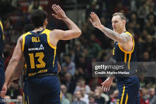 Janis Timma, #6 of Khimki Moscow Region and Anthony Gill, #13 of Khimki Moscow Region celebrate during the 2019/2020 Turkish Airlines EuroLeague...