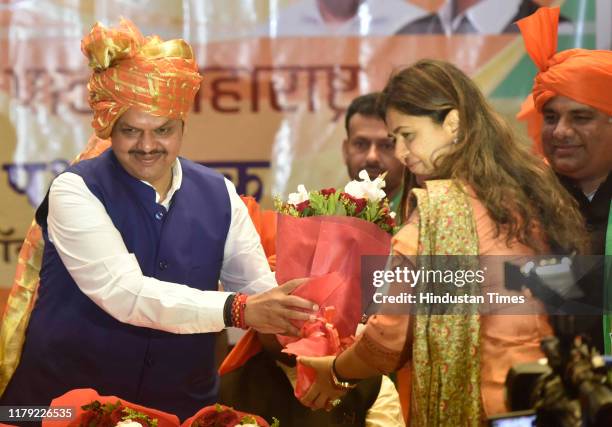 Devendra Incumbent Maharashtra Chief Minister Devendra Fadnavis along Pankaja ...